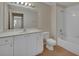 Well-lit bathroom showcasing a vanity with white cabinets and a shower-tub combo at 3546 Casalta Cir, New Smyrna Beach, FL 32168