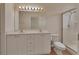 Clean bathroom featuring a double sink vanity, large mirror, and glass-enclosed walk-in shower at 3546 Casalta Cir, New Smyrna Beach, FL 32168