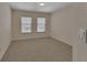 Bedroom with two windows, neutral walls, plush carpeting, and a ceiling fan at 3546 Casalta Cir, New Smyrna Beach, FL 32168