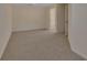 Empty bedroom with neutral walls and carpet showing entry to the walk-in closet and ensuite at 3546 Casalta Cir, New Smyrna Beach, FL 32168