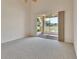 Bedroom with sliding glass doors to a screened lanai and bright neutral walls at 3546 Casalta Cir, New Smyrna Beach, FL 32168