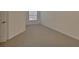 A simple bedroom bathed in natural light from the window at 3546 Casalta Cir, New Smyrna Beach, FL 32168