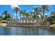 Serene community entrance featuring cascading fountains, lush landscaping, and the 'Venetian Bay' sign at 3546 Casalta Cir, New Smyrna Beach, FL 32168