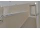 Hallway with neutral carpet and paint at 3546 Casalta Cir, New Smyrna Beach, FL 32168