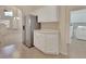 Bright kitchen with stainless steel refrigerator and white cabinetry at 3546 Casalta Cir, New Smyrna Beach, FL 32168