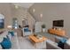Staged living room featuring high ceilings, carpet, and neutral-colored furniture at 3546 Casalta Cir, New Smyrna Beach, FL 32168