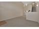 Spacious living room with high ceilings and neutral carpet at 3546 Casalta Cir, New Smyrna Beach, FL 32168