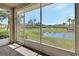 Screened patio providing tranquil views of the landscaped backyard and peaceful lake at 3546 Casalta Cir, New Smyrna Beach, FL 32168