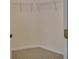A walk-in closet features white wire shelving and neutral colored carpet at 3546 Casalta Cir, New Smyrna Beach, FL 32168