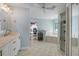 Open bathroom with a soaking tub, tiled shower, and access to an office provides a great space to relax at 3728 Egret Dunes Dr, Ormond Beach, FL 32176
