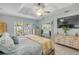 Bright bedroom with tile floor and plenty of windows, complemented by a ceiling fan and adjacent outdoor patio at 3728 Egret Dunes Dr, Ormond Beach, FL 32176