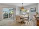 Bright dining area with backyard and pool views, complemented by stylish furnishings and natural light at 3728 Egret Dunes Dr, Ormond Beach, FL 32176