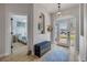 Entryway with wood floors, decorative rug, bench, and view of bedroom and entryway at 3728 Egret Dunes Dr, Ormond Beach, FL 32176