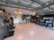 Ample storage and workspace in this spacious, well-lit garage with custom cabinets, shelving, and epoxy flooring at 3728 Egret Dunes Dr, Ormond Beach, FL 32176