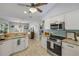Well-lit kitchen featuring stainless steel appliances, granite counters, and a breakfast bar at 3728 Egret Dunes Dr, Ormond Beach, FL 32176