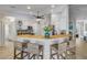 Beautiful kitchen with white cabinets, a breakfast bar, and views to the living spaces at 3728 Egret Dunes Dr, Ormond Beach, FL 32176