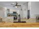 Bright kitchen with granite countertops, modern appliances, and a stylish wooden breakfast bar at 3728 Egret Dunes Dr, Ormond Beach, FL 32176