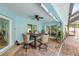 Charming outdoor patio with stylish seating, ceiling fan, and well-manicured landscaping is ideal for relaxation at 3728 Egret Dunes Dr, Ormond Beach, FL 32176