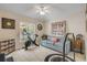 Brightly lit room with exercise equipment, comfortable seating, and neutral decor at 3728 Egret Dunes Dr, Ormond Beach, FL 32176