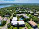 An aerial view captures the community's layout, surrounded by lush trees and waterfront views at 3800 Saxon Dr # 250, New Smyrna Beach, FL 32169