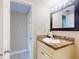 Bathroom featuring a vanity with a granite countertop and modern fixtures at 3800 Saxon Dr # 250, New Smyrna Beach, FL 32169