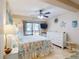 Inviting bedroom with ceiling fan, sliding glass door, and coastal-themed decor, creating a serene atmosphere at 3800 Saxon Dr # 250, New Smyrna Beach, FL 32169
