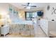 Inviting bedroom with ceiling fan, sliding glass door, and coastal-themed decor, creating a serene atmosphere at 3800 Saxon Dr # 250, New Smyrna Beach, FL 32169