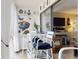 Bright dining area featuring a coastal theme, white furnishings, and access to an outdoor living space at 3800 Saxon Dr # 250, New Smyrna Beach, FL 32169