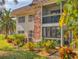 Exterior view of property with landscaped garden at 3800 Saxon Dr # 250, New Smyrna Beach, FL 32169