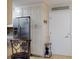 Bright kitchen features white cabinets, stainless steel refrigerator, and decorative signage at 3800 Saxon Dr # 250, New Smyrna Beach, FL 32169