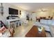 Comfortable living room with a television and a dining area at 3800 Saxon Dr # 250, New Smyrna Beach, FL 32169