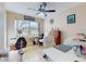 Spacious home office features a ceiling fan, desk, and exercise equipment at 3800 Saxon Dr # 250, New Smyrna Beach, FL 32169