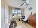 Bright office space with an exercise bike, desk, and large window for plenty of natural light at 3800 Saxon Dr # 250, New Smyrna Beach, FL 32169