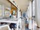 Enclosed porch with dining table and seating, decorated in nautical theme at 3800 Saxon Dr # 250, New Smyrna Beach, FL 32169