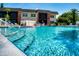 Inviting community pool area with lounge chairs for relaxation and enjoyment at 3800 Saxon Dr # 250, New Smyrna Beach, FL 32169