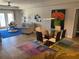 Open living area with dining table and view to outdoor balcony at 424 Luna Bella Ln # 226, New Smyrna Beach, FL 32168