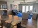 Living area with view of dining area, outdoor patio and lots of natural light at 424 Luna Bella Ln # 226, New Smyrna Beach, FL 32168