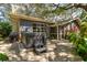 Relaxing backyard featuring a private hot tub, patio and lush landscaping at 4426 Saxon Dr, New Smyrna Beach, FL 32169