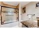 Bathroom with a shower-tub combo, a large granite vanity, and neutral decor at 4426 Saxon Dr, New Smyrna Beach, FL 32169