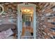 View of the front door from the covered brick porch with a view into the house at 4426 Saxon Dr, New Smyrna Beach, FL 32169