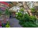 Inviting brick pathway leads to the entrance surrounded by lush landscaping at 4426 Saxon Dr, New Smyrna Beach, FL 32169