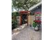 Charming front yard with Asian themed decor and landscaping at 4426 Saxon Dr, New Smyrna Beach, FL 32169