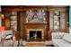Living room view with fireplace surrounded by wood built-in cabinets at 4426 Saxon Dr, New Smyrna Beach, FL 32169