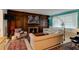 Cozy living room with hardwood accents, a fireplace, plenty of natural light and comfortable sofas at 4426 Saxon Dr, New Smyrna Beach, FL 32169