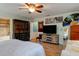 Spacious main bedroom with hardwood floors and access to a bathroom at 4426 Saxon Dr, New Smyrna Beach, FL 32169