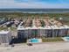 Aerial view of condo complex on the beach with lake and residential area behind at 4445 S Atlantic Ave # 804, Ponce Inlet, FL 32127
