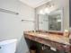 Bathroom featuring a vanity with mirror and granite countertops at 4445 S Atlantic Ave # 804, Ponce Inlet, FL 32127
