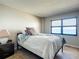 Bedroom with serene ocean view from the window and a comfortable bed at 4445 S Atlantic Ave # 804, Ponce Inlet, FL 32127