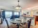Modern dining room with stylish lighting, furniture and an ocean view at 4445 S Atlantic Ave # 804, Ponce Inlet, FL 32127