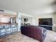 View of a well-lit living room with an open concept layout at 4445 S Atlantic Ave # 804, Ponce Inlet, FL 32127